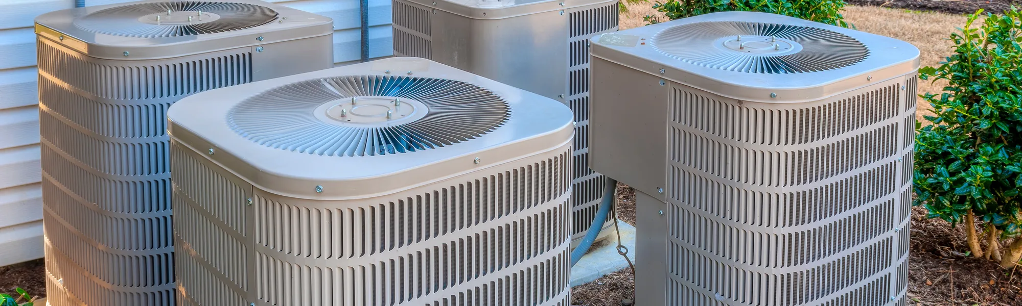 Row of residential air conditioning condenser units